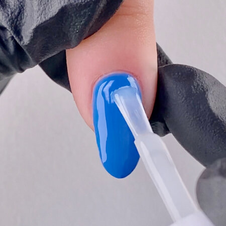 Apply a thin coat of Stay Matte Top Coat leaving a tiny margin around the cuticle line. Cap the free edge to prevent shrinking. Cure for 30 seconds in the OPI LED Light.