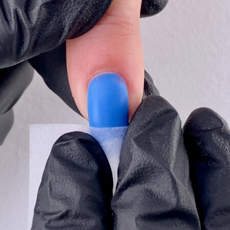 Remove the gel residue with a Nail Wipe saturated with N.A.S. 99 Cleansing Solution. Finish by applying a drop of ProSpa Nail & Cuticle Oil and massage in